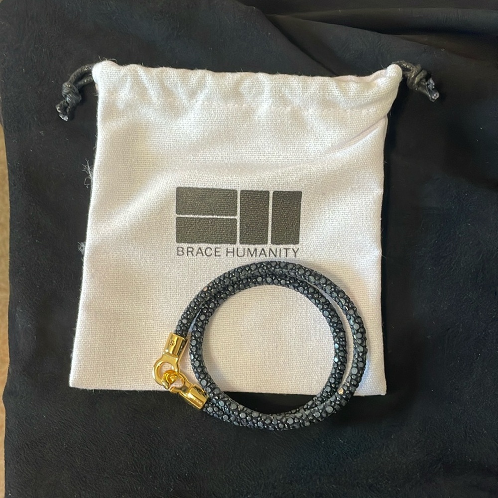Brace Humanity black bracelet.   Worn once.   In new condition.